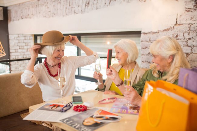 new-hat-women-sitting-looking-excited-while-trying-new-hat