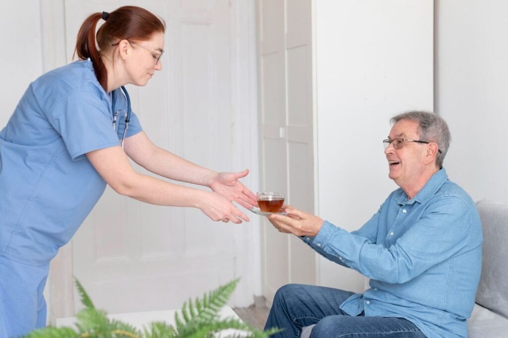 Caregiver bringing tea cup