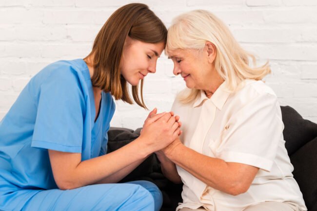 nurse-old-woman-holding-their-hands-together