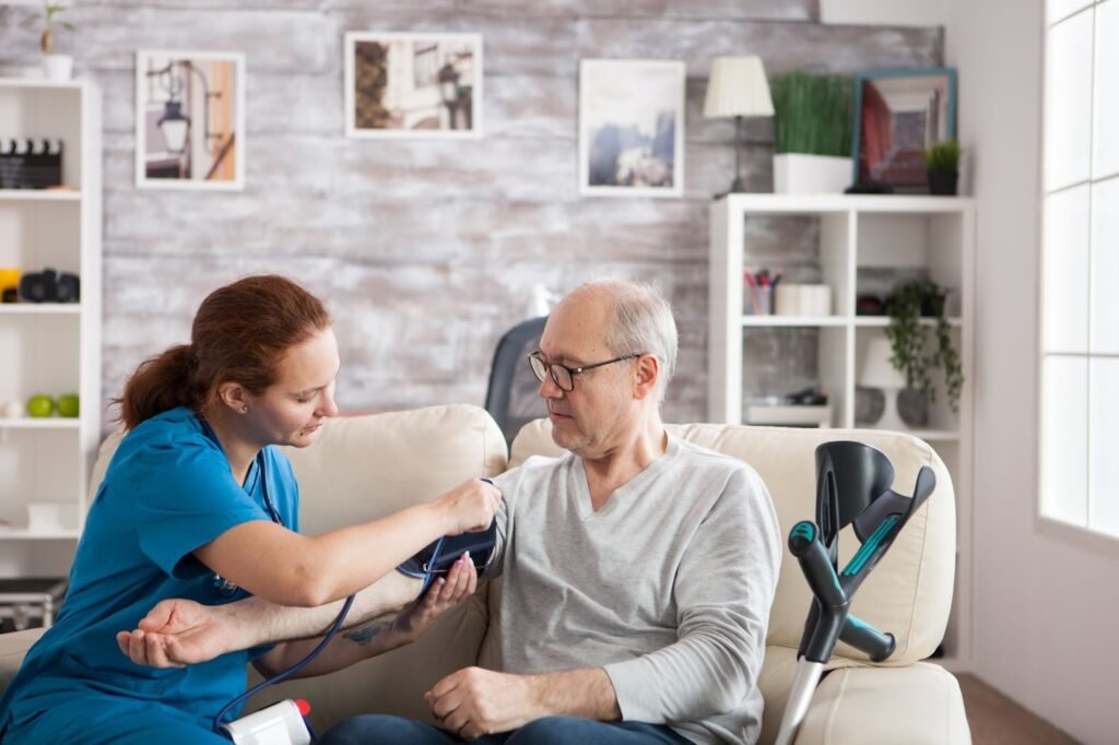 A nurse measuring a senior man's blood pressure