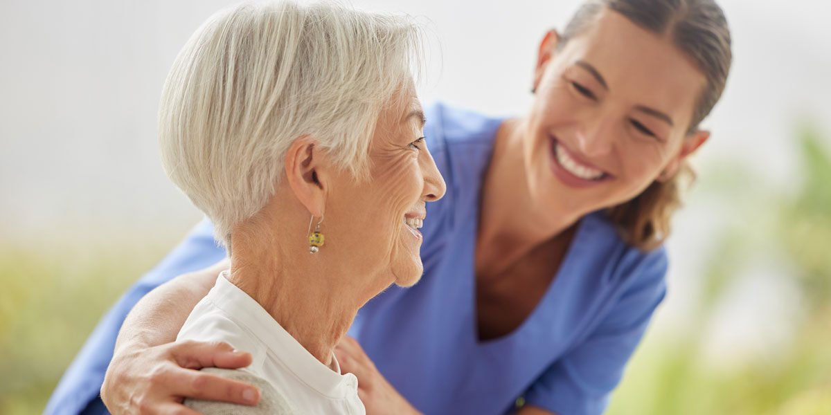 friendly-nurse-doctor-offering-patient-support-during-recovery-loving-caregiver-taking-care-her-patient-showing-kindness-while-doing-checkup-assisted-living-home