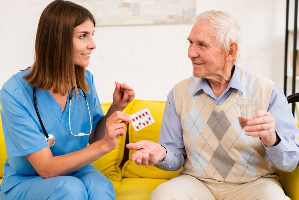 A nurse handing over medicine to an senior man